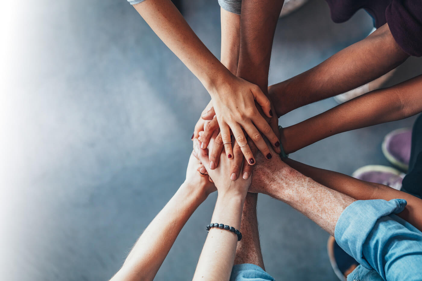 People holding hands in a circle